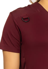 Trendy maroon jogger scrub set featuring convenient storage.