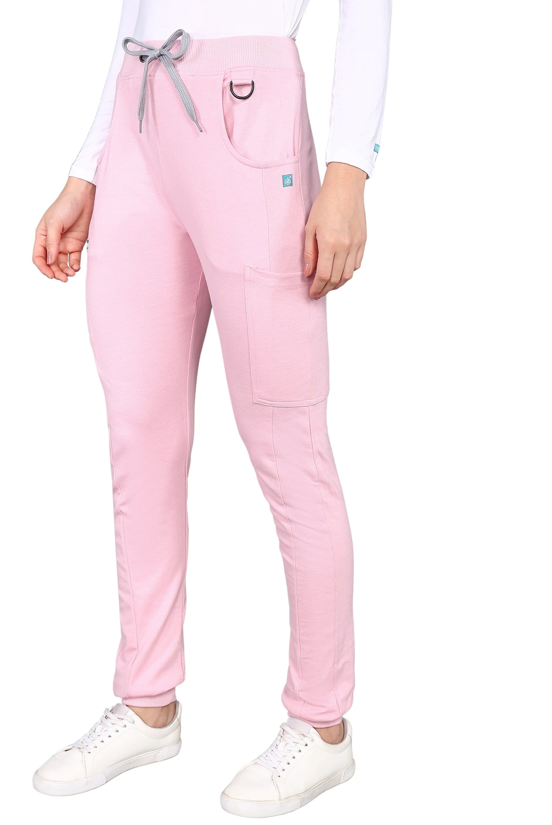 Essential pink jogger scrub set equipped with pockets.