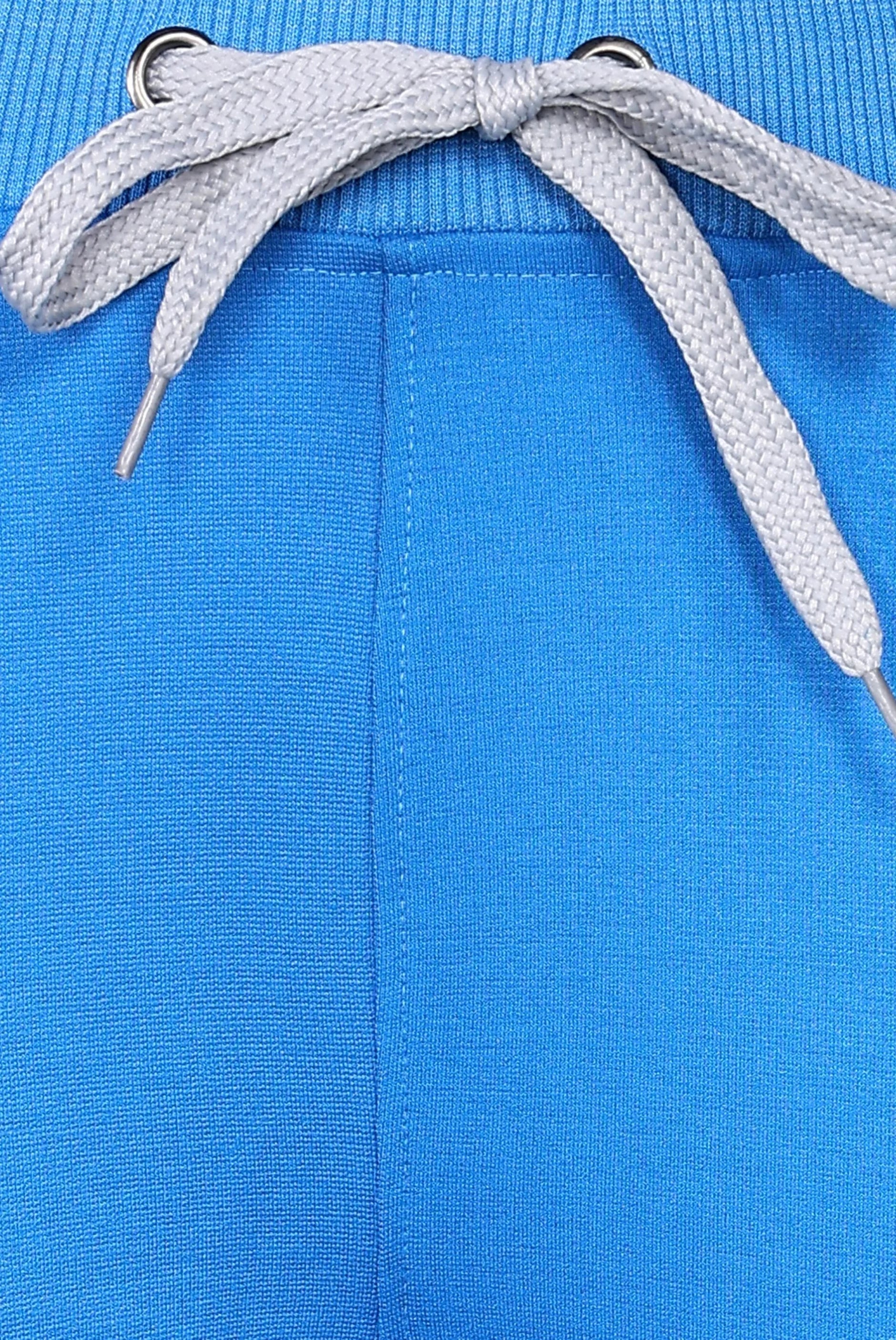 Convenient royal blue jogger scrub set for professional environments.